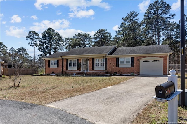 ranch-style home with brick siding, fence, a garage, crawl space, and driveway