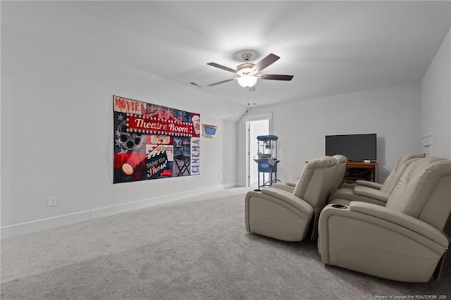 home theater room featuring visible vents, baseboards, a ceiling fan, and carpet flooring