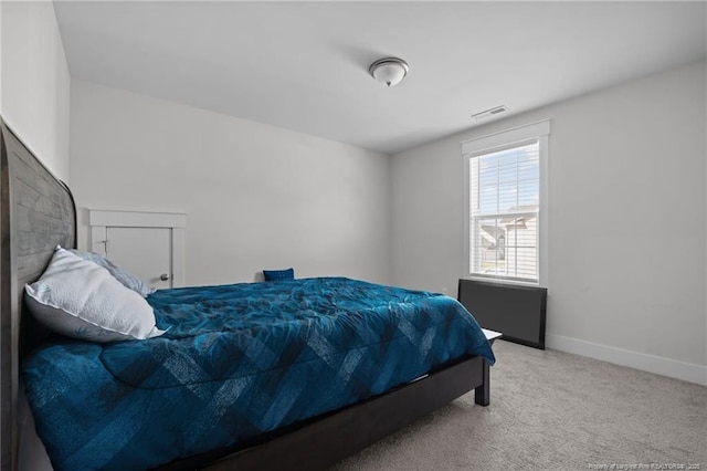 bedroom with visible vents, baseboards, and carpet floors