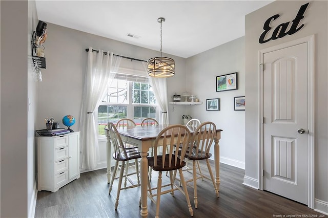 dining space featuring visible vents, baseboards, and dark wood-style flooring