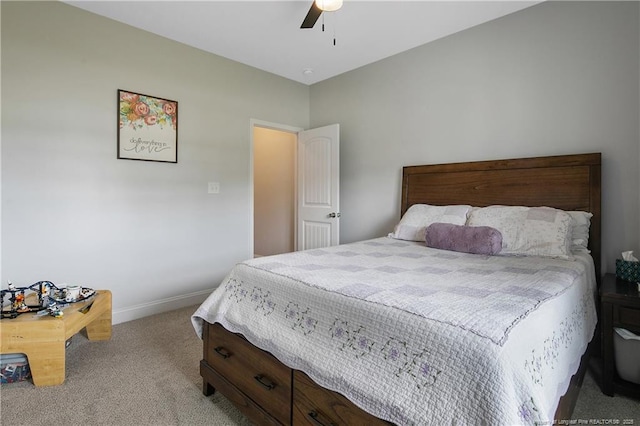 carpeted bedroom with baseboards and ceiling fan