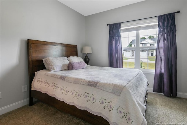 carpeted bedroom featuring baseboards