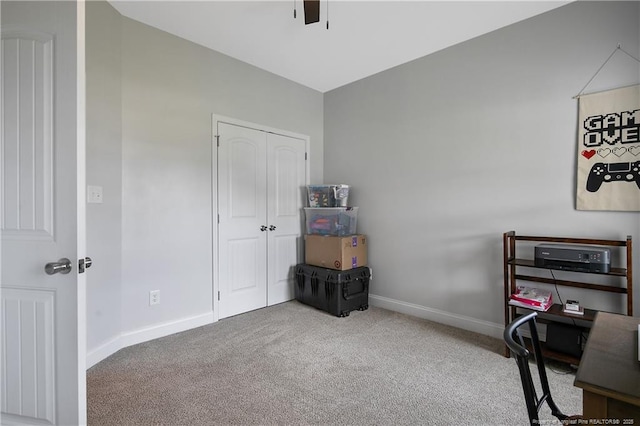 office space featuring baseboards, carpet, and ceiling fan