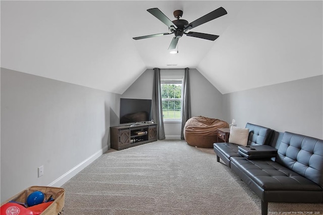 living area with carpet flooring, baseboards, lofted ceiling, and a ceiling fan