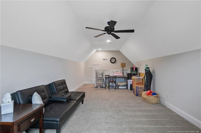 interior space with visible vents, carpet floors, baseboards, ceiling fan, and vaulted ceiling