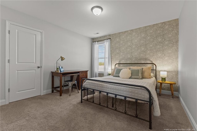 bedroom featuring carpet flooring and baseboards