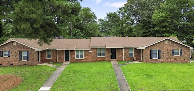 ranch-style house with a front yard, brick siding, and crawl space