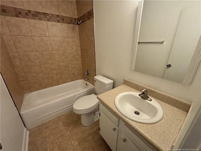 bathroom with vanity, tile patterned floors, toilet, and washtub / shower combination