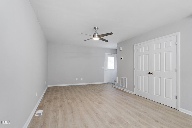 unfurnished bedroom with light wood-type flooring, visible vents, and baseboards