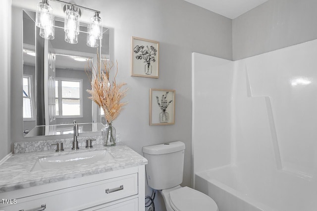 bathroom with vanity and toilet