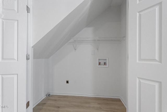 laundry room with baseboards, hookup for an electric dryer, laundry area, washer hookup, and light wood-style floors