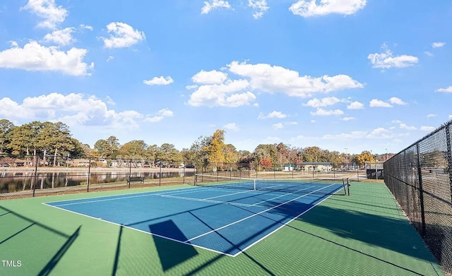 view of sport court featuring fence