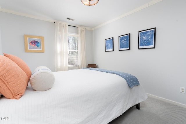 bedroom with visible vents, baseboards, carpet flooring, and crown molding