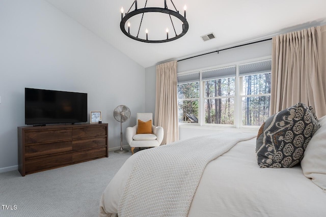 bedroom with visible vents, lofted ceiling, carpet floors, baseboards, and a chandelier