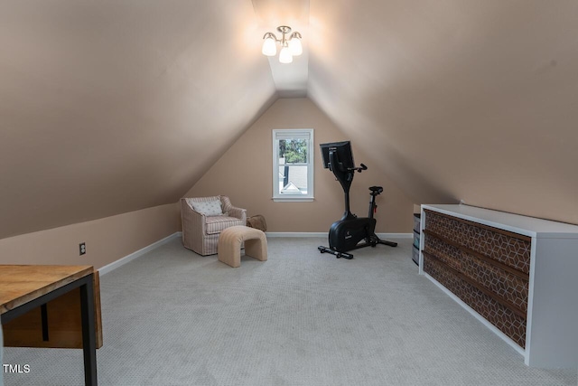 living area with baseboards, carpet floors, and vaulted ceiling