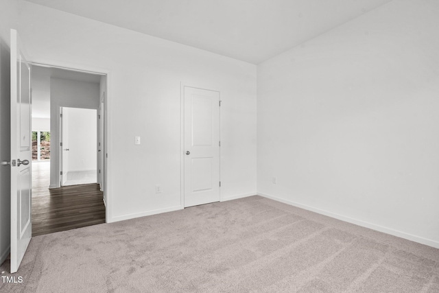 unfurnished bedroom with baseboards and carpet floors