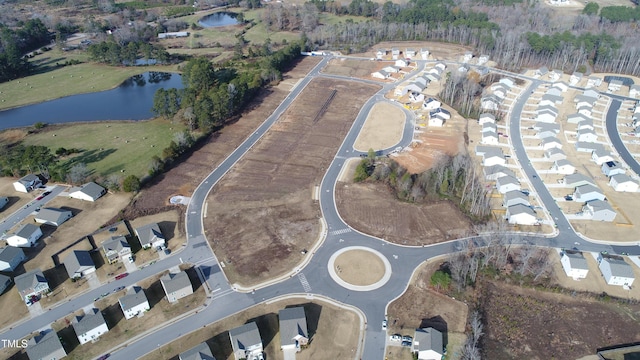 aerial view with a water view and a residential view