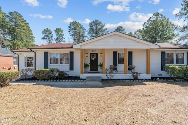 ranch-style house featuring brick siding, crawl space, and covered porch