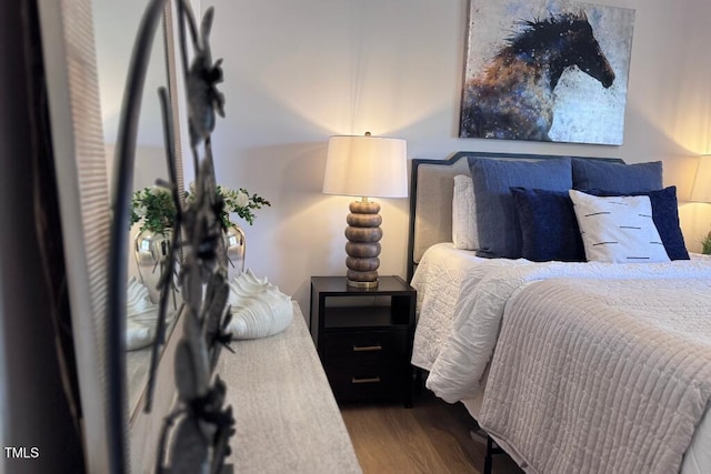 bedroom featuring wood finished floors