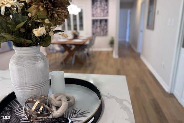 interior details with wood finished floors and baseboards