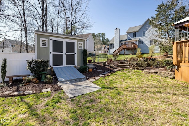 view of shed featuring a residential view and fence