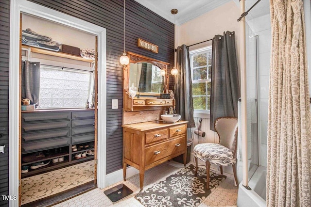 bathroom with vanity and ornamental molding