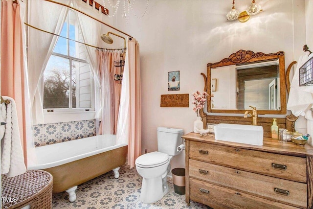 bathroom featuring toilet and vanity