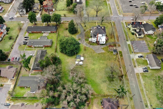 birds eye view of property with a residential view