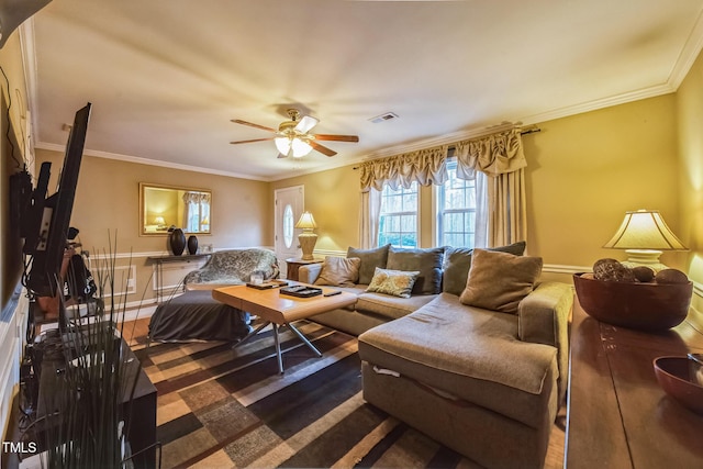 living room with crown molding, visible vents, and ceiling fan