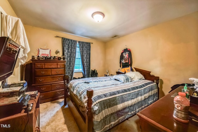 bedroom with visible vents and light colored carpet