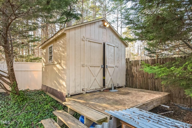 view of shed featuring a fenced backyard