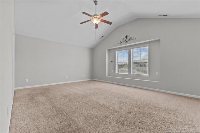 spare room with carpet flooring, baseboards, and ceiling fan