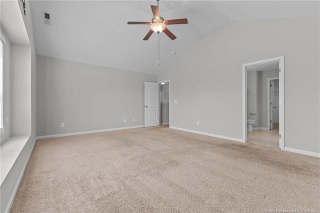 empty room featuring visible vents, light carpet, high vaulted ceiling, baseboards, and ceiling fan