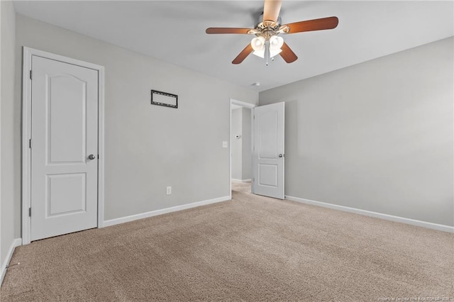 unfurnished bedroom with baseboards, ceiling fan, and carpet flooring