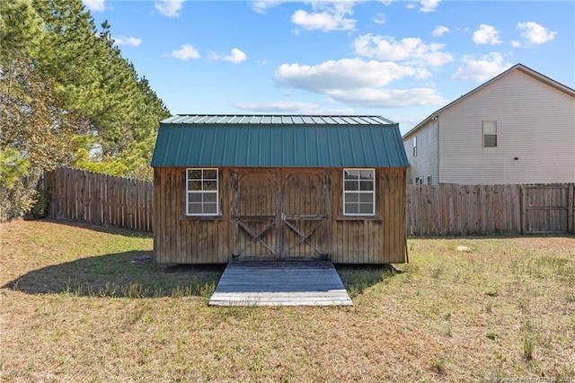 view of shed featuring a fenced backyard