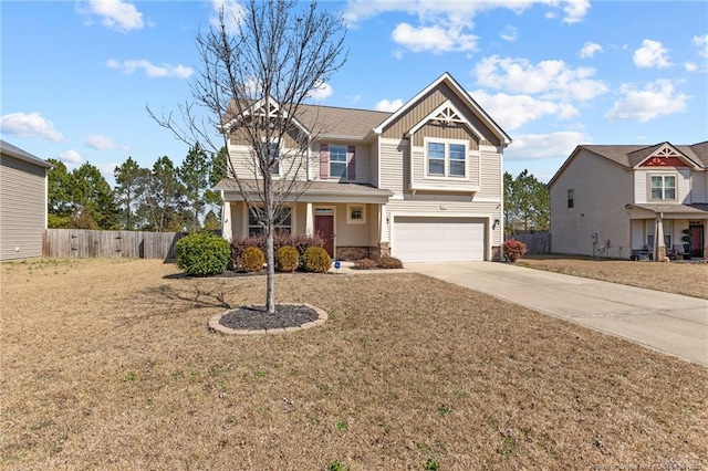 view of front of home featuring driveway, fence, board and batten siding, a front yard, and an attached garage