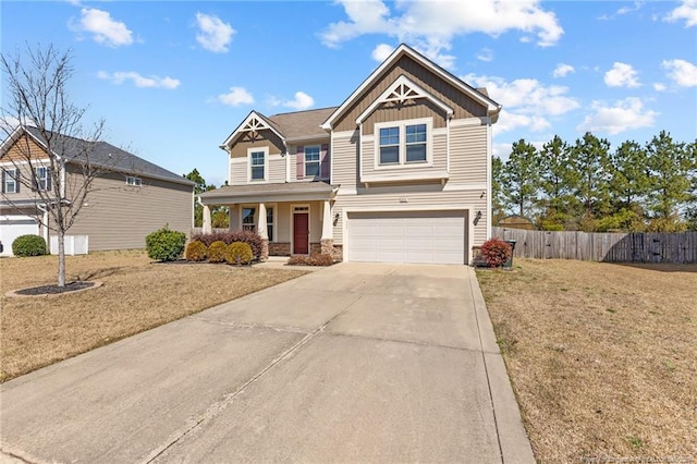 craftsman house featuring board and batten siding, a front lawn, fence, concrete driveway, and a garage