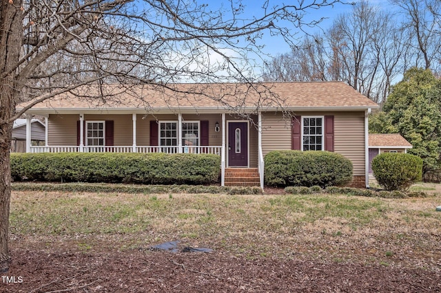 single story home featuring a porch and roof with shingles