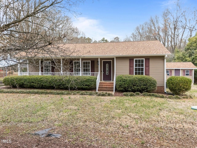 single story home featuring covered porch and a shingled roof