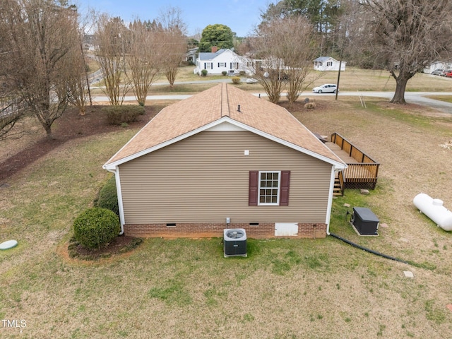 view of property exterior with a lawn, central AC, and crawl space