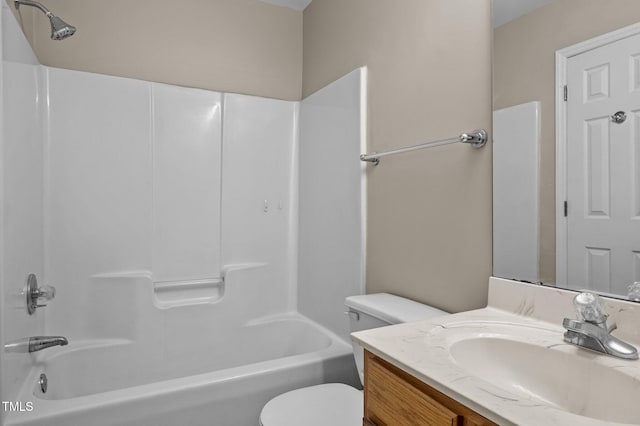 bathroom featuring vanity,  shower combination, and toilet