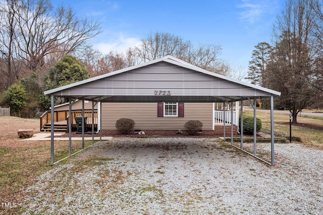 view of side of property with a detached carport