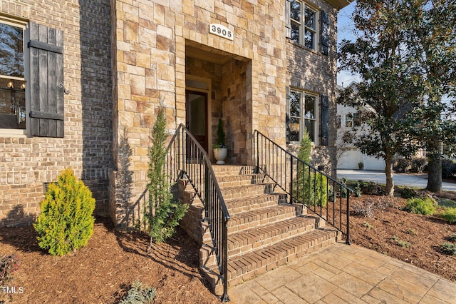 entrance to property with stone siding