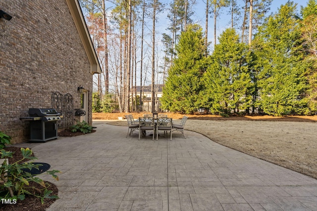 view of patio featuring a grill