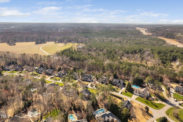 bird's eye view featuring a forest view