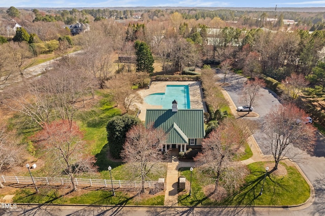 birds eye view of property with a wooded view