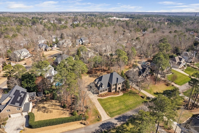 drone / aerial view with a view of trees and a residential view