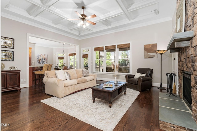 living area with dark wood-style flooring, a fireplace, a ceiling fan, and coffered ceiling