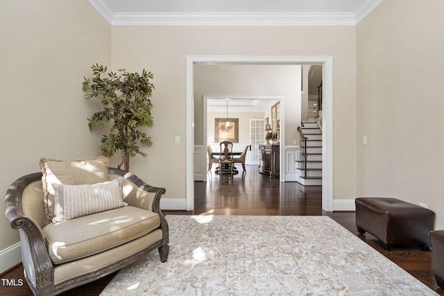 living area with stairs, baseboards, dark wood-style flooring, and ornamental molding