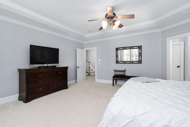 bedroom with ornamental molding, light colored carpet, baseboards, and ceiling fan